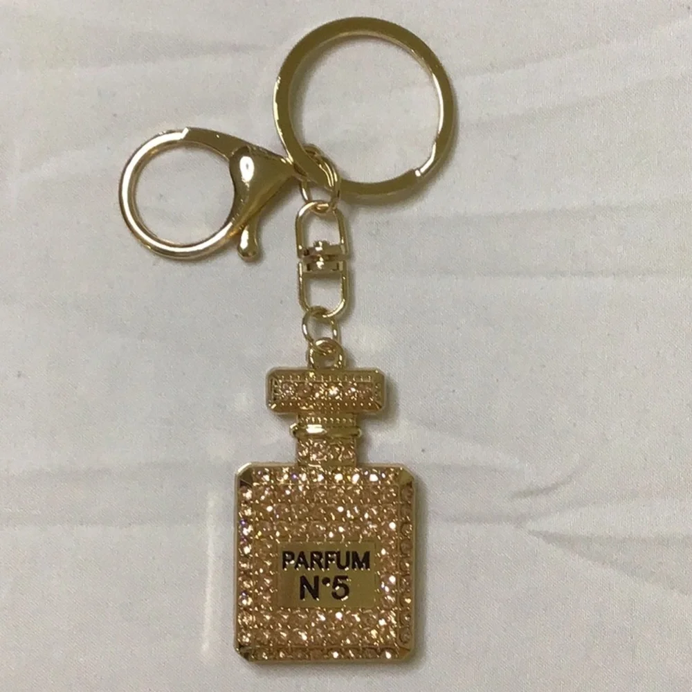 Gold finish Key Holder with‎ Perfume Bottle Design